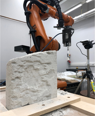 A KUKA KR60 industrial robotic arm performing autonomous carving.